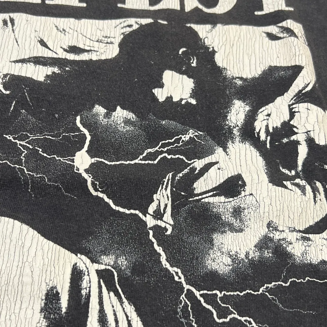 SAINT Mxxxxxx LS TEE/TEMPEST/BLK 'TEMPEST SAINT' Storm Religious Saints Cracked Retro Vulcanized Heavy Wash Long Sleeves Washed Black S-XL Assute Dyeing Multi-bit Horse Fading Craftsmanship Grinding and Hanging Holes Full of Old Feeling Top Printing Craftsmanship Purchasing Level